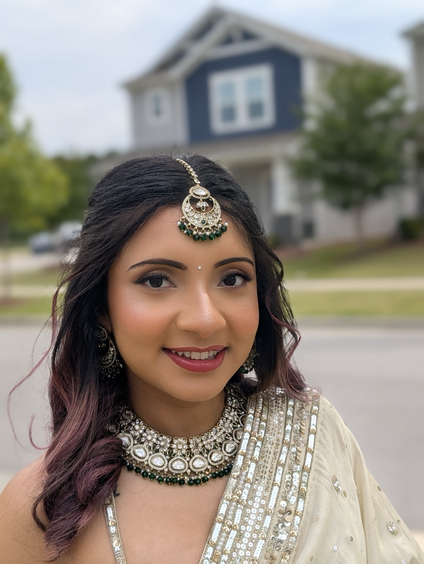 South Asian engagement makeup with maang tikka and kundan choker jewelry setting by Ritu Patel NC
